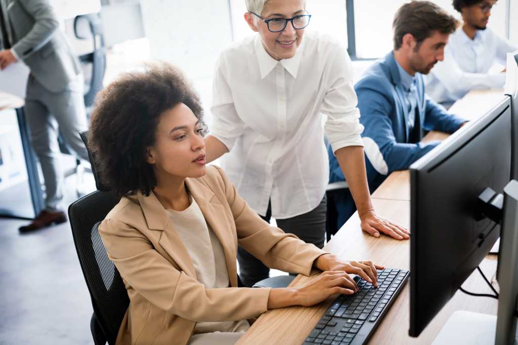 Group of business people working together, brainstorming in office