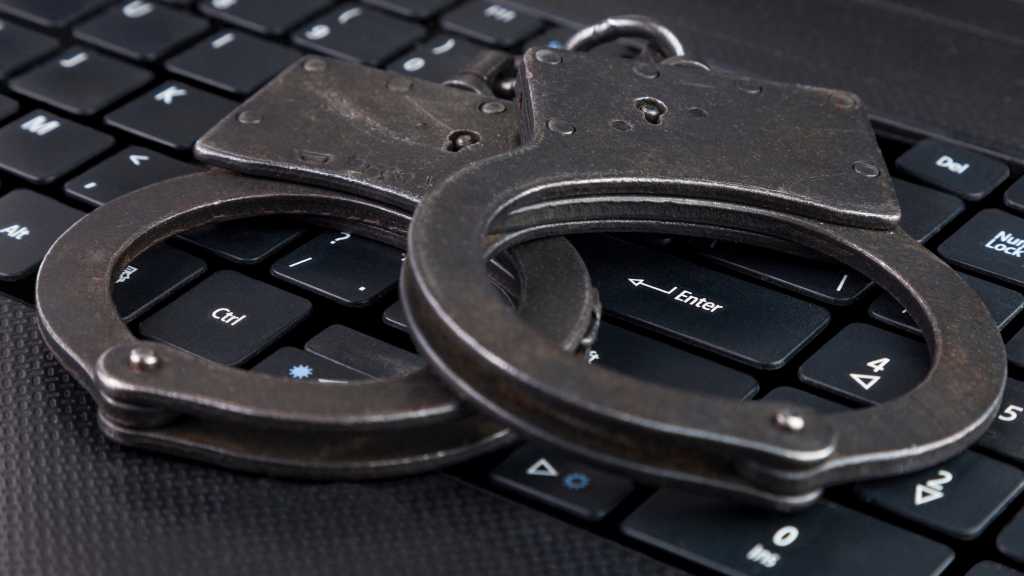 Handcuffs on Laptop 16z9