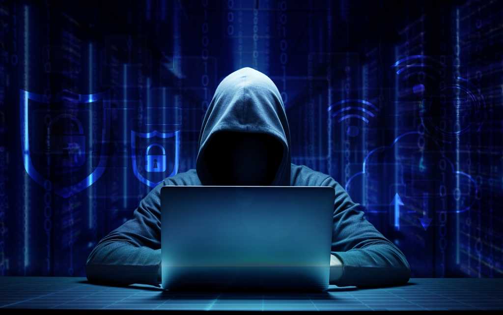 hooded hacker online security concept