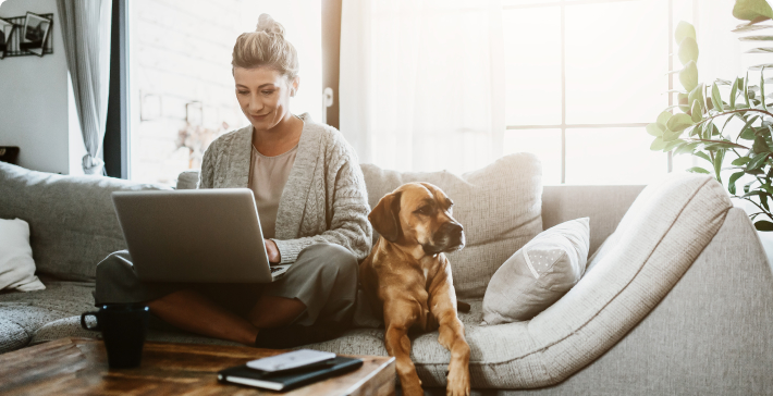 woman shopping online with her pet dog