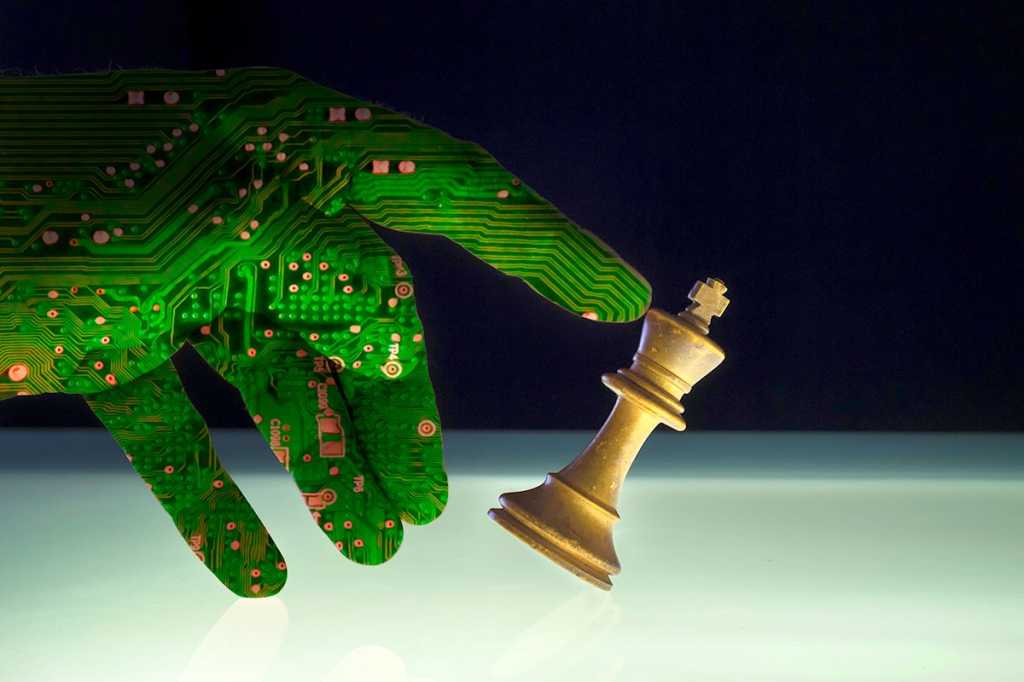 security threat - circuit board-hand knocking over a chess piece