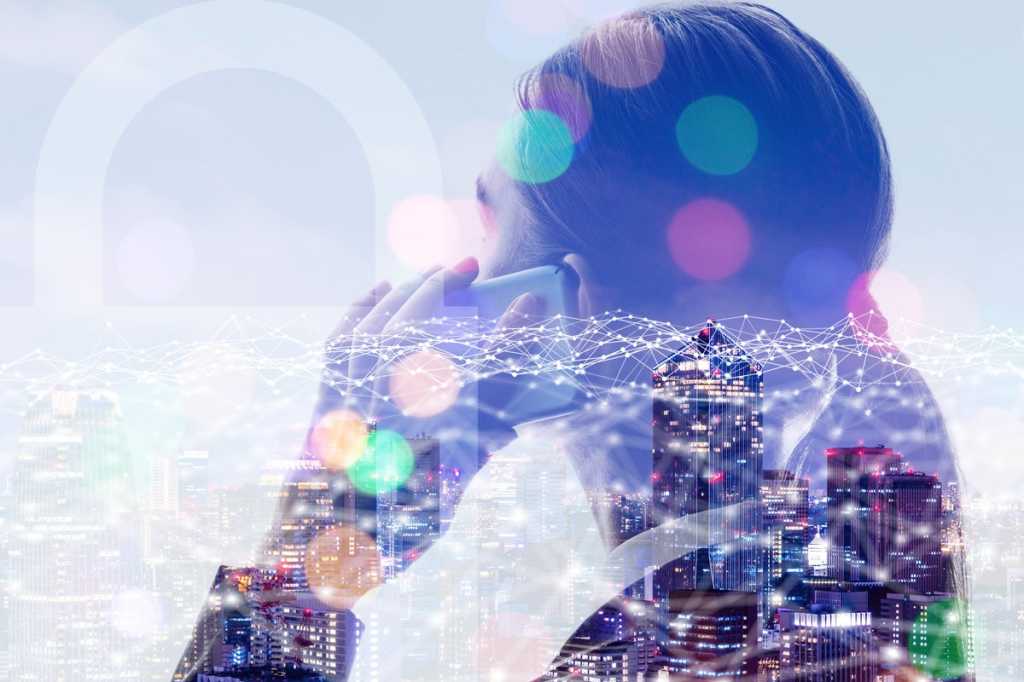 woman on smartphone city network security leader iot